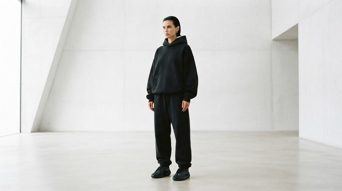 JUJU Drop 003, photographed in black in a bare concrete room